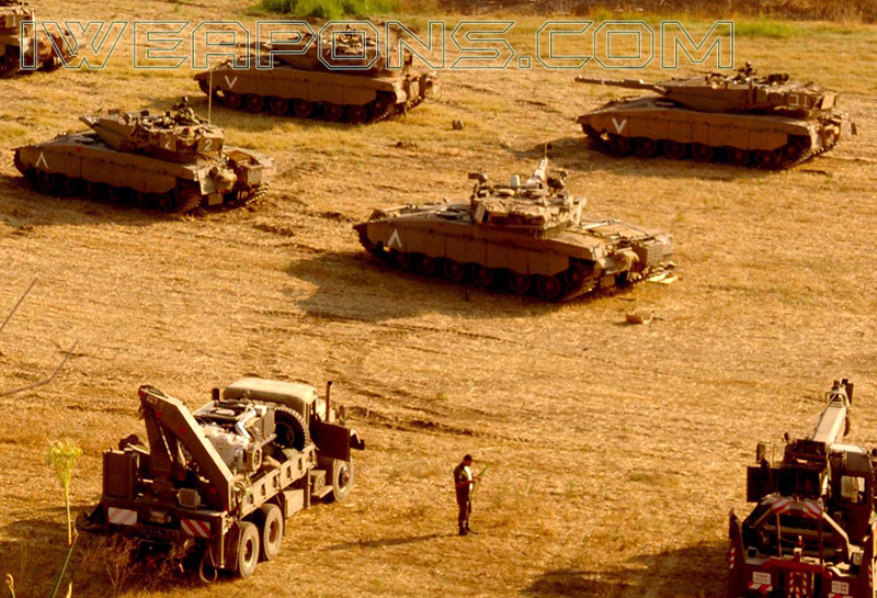 Merkava tanks with 2 trucks carrying power pack